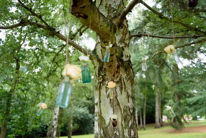 hanging-roses-in-apothecary-bottles-wedding-flowers-2