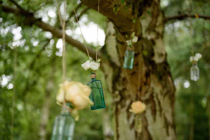 hanging-roses-in-apothecary-bottles-wedding-flowers-3