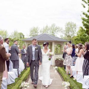 outdoor-wedding-ceremony-at-warwick-house-jugs-down-the-aisle-2