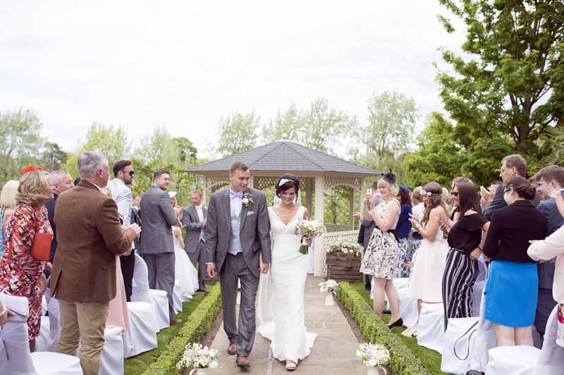 outdoor-wedding-ceremony-at-warwick-house-jugs-down-the-aisle-2