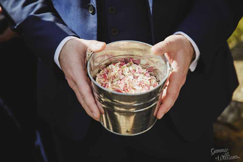 Pink-and-cream-confetti-petals-insilver-buckets-for-guests-to-help-themselves