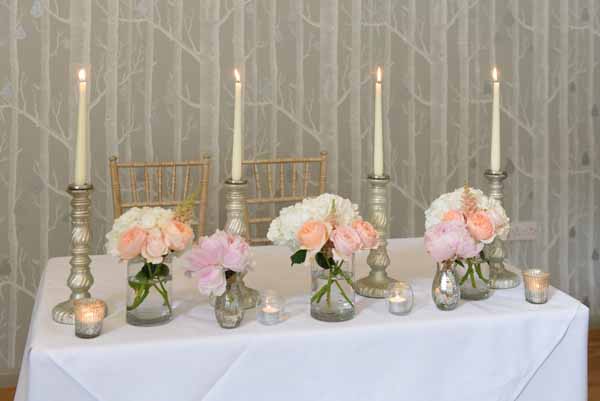 pink-peach-wedding-ceremony-table-flowers-in-glass-vases-and-mercury-silver-vases-hampton-manor