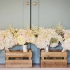 Pretty-bridesmaids-bouquets-delivered-in-wooden-crates.-Hydrangeas-astilbe-avalanche-and-sweet-avalanche-roses