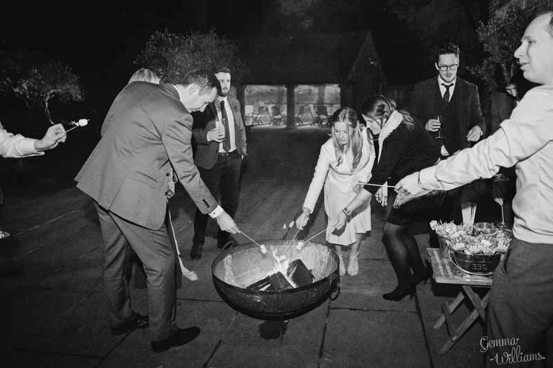 Roasting-marshmallows-at-Shustoke-Farm-Barns-wedding