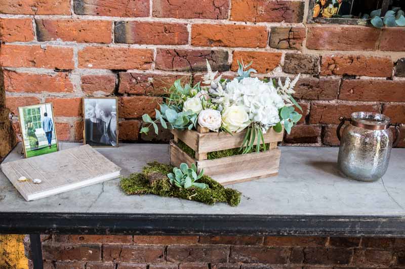 rustic-crate-of-flowers-of-guest-book-table-at-shustoke-farm-barns