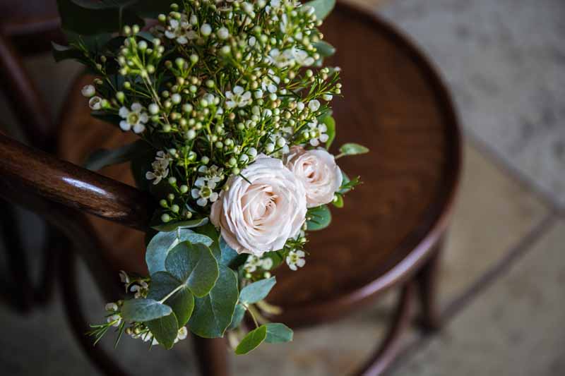 rustic-pew-ends-at-barn-wedding-ceremony