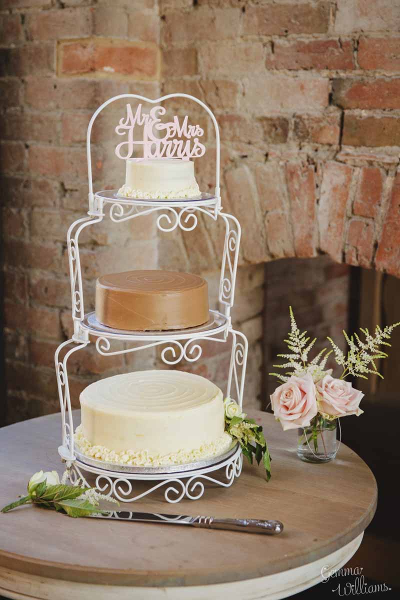 Wedding-cake-at-barn-wedding-with-personalised-cake-topper