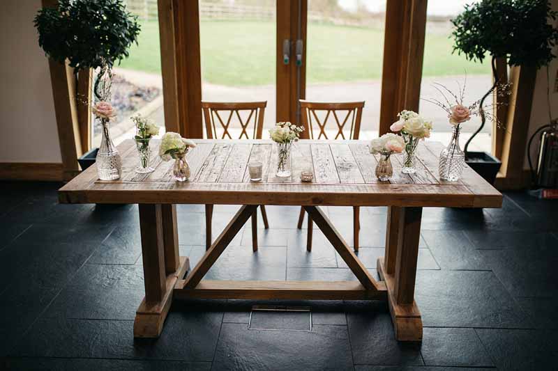 wedding-ceremony-table-flowers-in-mercury-silver-and-crystal-glass-vases