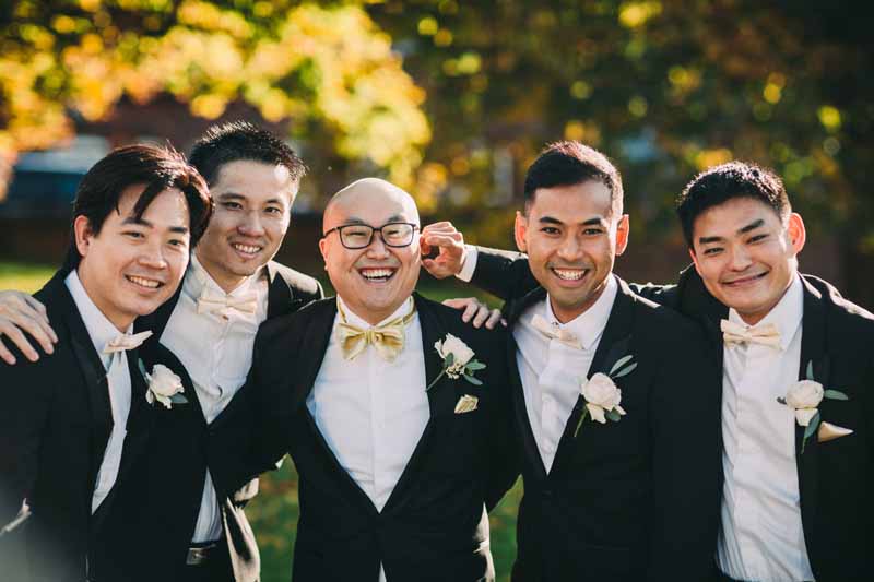 black-grooms-suits-blush-pink-rose-button-holes