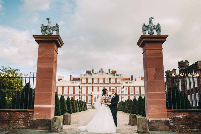 bride-and-groom-portraits-knowsley-hall-deep-pink-burgundy-wedding-bouquet-1