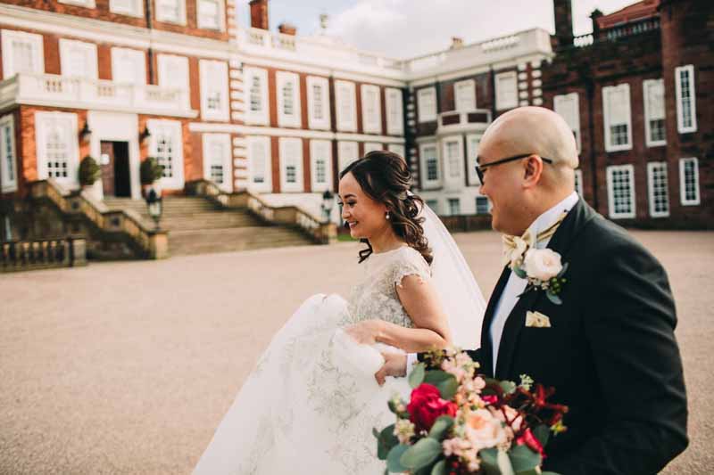 bride-and-groom-portraits-knowsley-hall-deep-pink-burgundy-wedding-bouquet-2