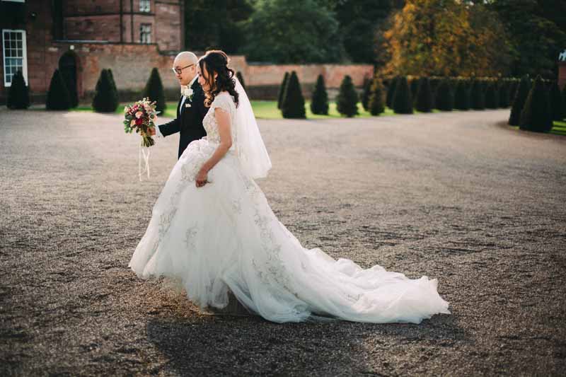 bride-and-groom-portraits-knowsley-hall-deep-pink-burgundy-wedding-bouquet-3