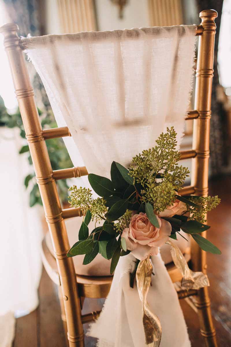 floral-wedding-chair-backs-blush-pink-roses-with-foliage-at-knowsley-hall