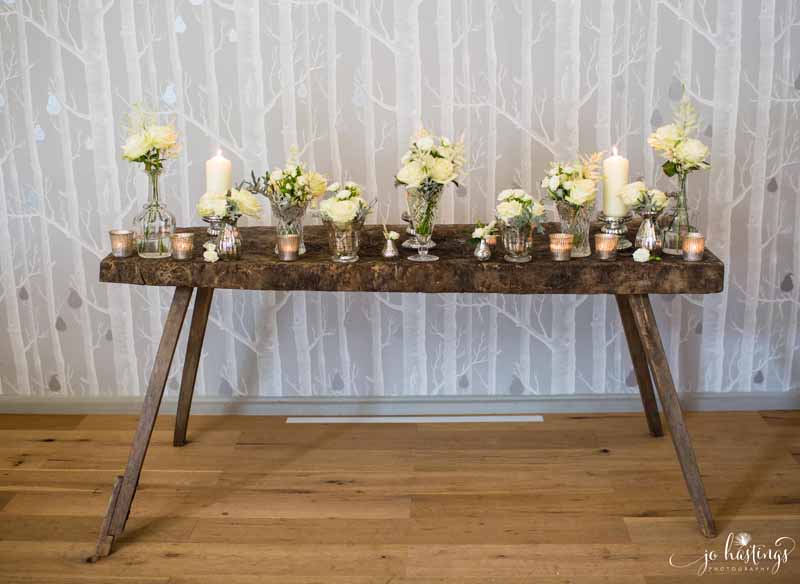 Elegant wedding ceremony table styling crystal vases mercury silver vases cream flowers Hampton Manor