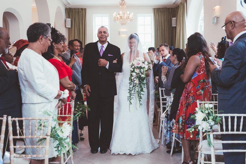 Wedding ceremony chair flowers trailing bridal bouquet Iscoy Park