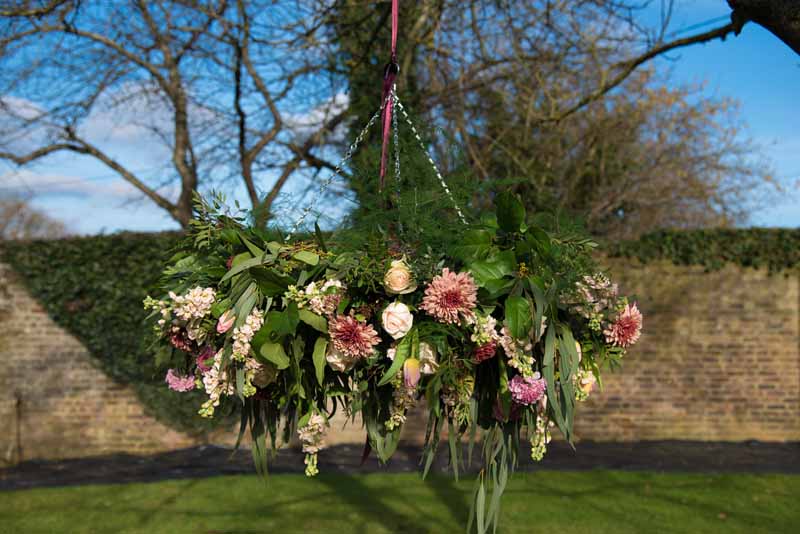 Hanging flowers over top table wedding ideas