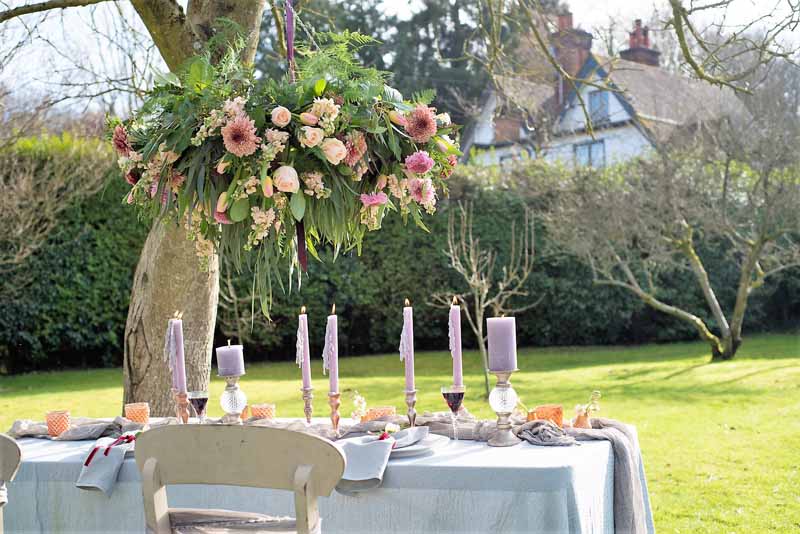 Hanging flowers over top table wedding ideas