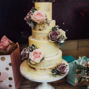 semi naked wedding cake with dusky pink roses Passion for Flowers