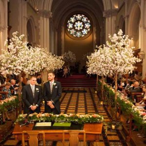 Epic wedding ceremony decorations trees metres of flowers length of the church Stanbrook Abbey wedding by Passion for Flowers 2