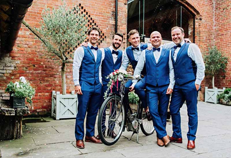 Groomsmen navy suits bicycle flowers Shustoke Farm Barns wedding florist Passion for Flowers