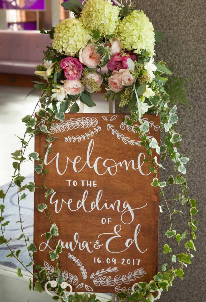 Wooden wedding welcome sign flowers trailing Passion for Flowers