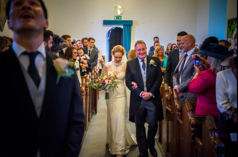 Bride and father walking down the church aisle organic bouquet by Passion for Flowers