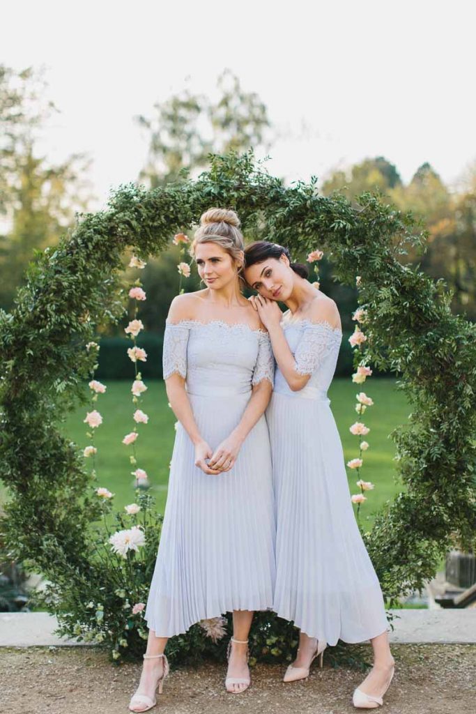 Coast bridesmaids dresses round wedding moongate arch by Passion for Flowers