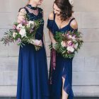 Deep pink and green bridesmaids bouquets with navy blue dresses