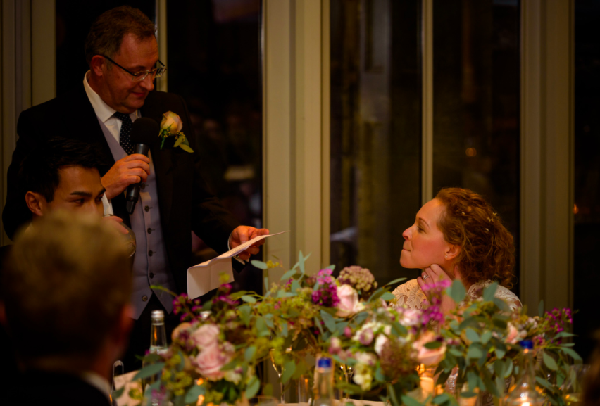 Flowers on top table important for wedding speech photos - Hampton Manor