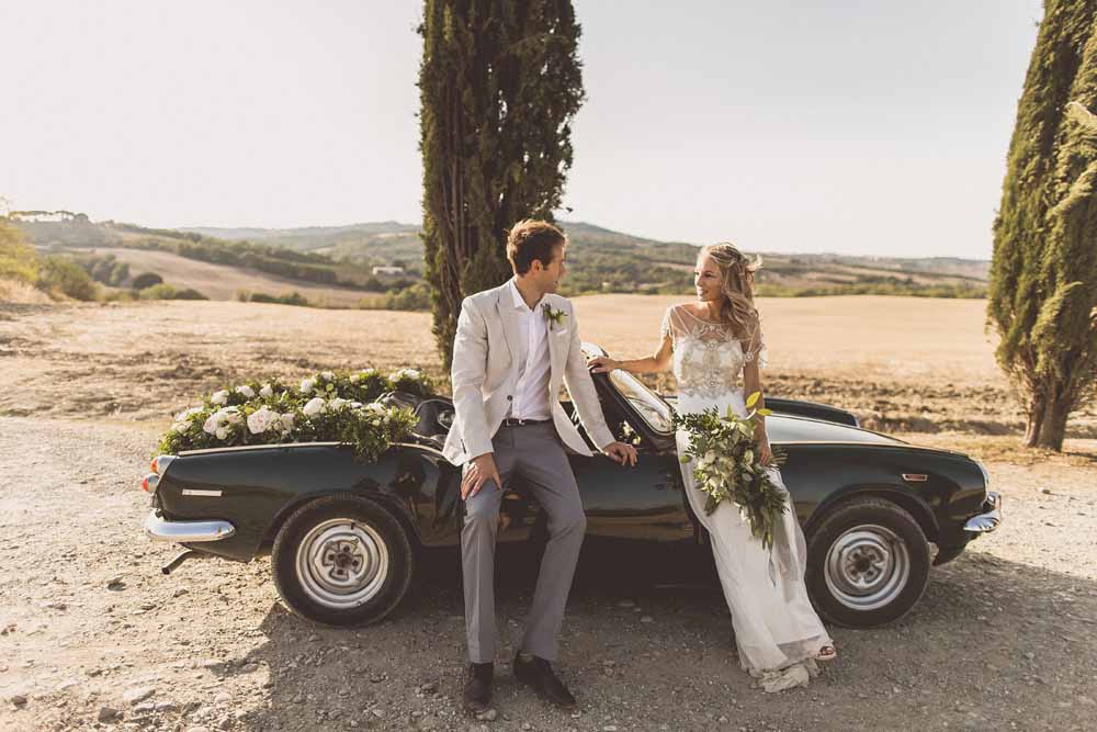 Anna Campbell Adelaide Wedding Gown, Couple portraits Destination wedding Tuscany, Wedding Car Garlands