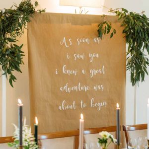 wedding-backdrop-ideas-brown-paper-and-calligraphy-quote