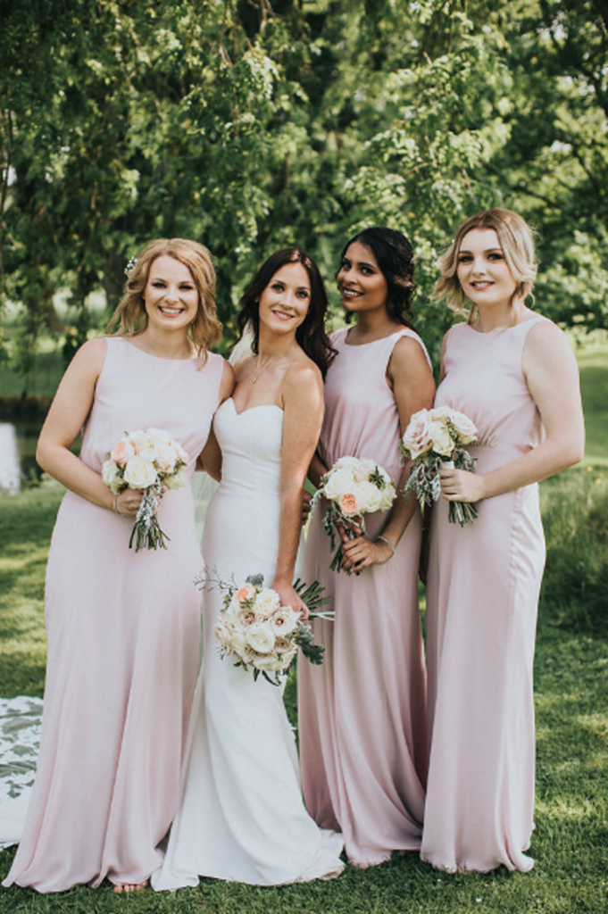 Elegant bride and bridesmaids blush pink dresses