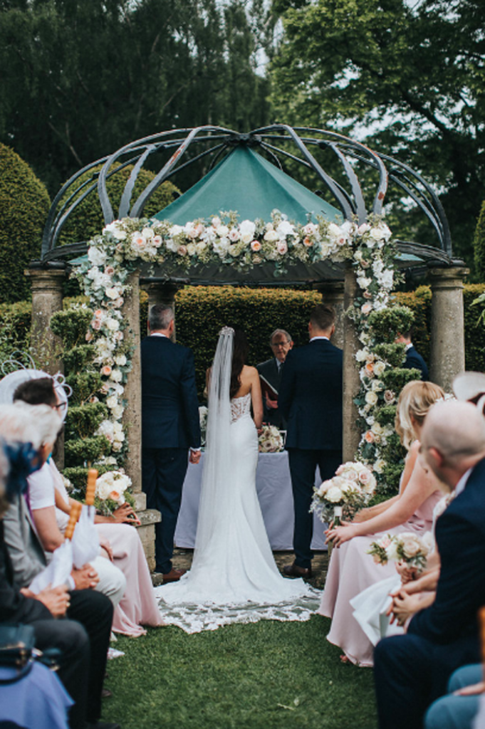 Large rose flower arch outdoor wedding ceremony Birtsmorton Court Passion for Flowers