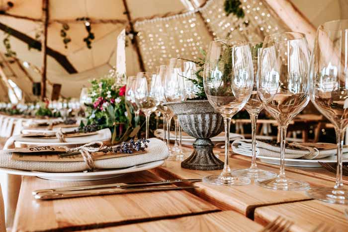 Festival wedding flowers centrepieces summer wedding in Tipi - florist: Passion for Flowers