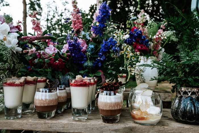 Add floral touches to your dessert table for a rustic festival wedding - florist: Passion for Flowers, tipi wedding ideas 