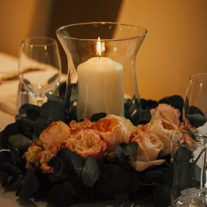 Low wedding centrepieces luxury roses with candle in centre country pub wedding venue Passion for Flowers wedding florists Solihull