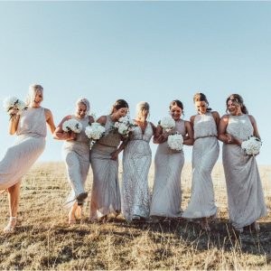White hydrangea bouquets bridesmaids summer barn wedding