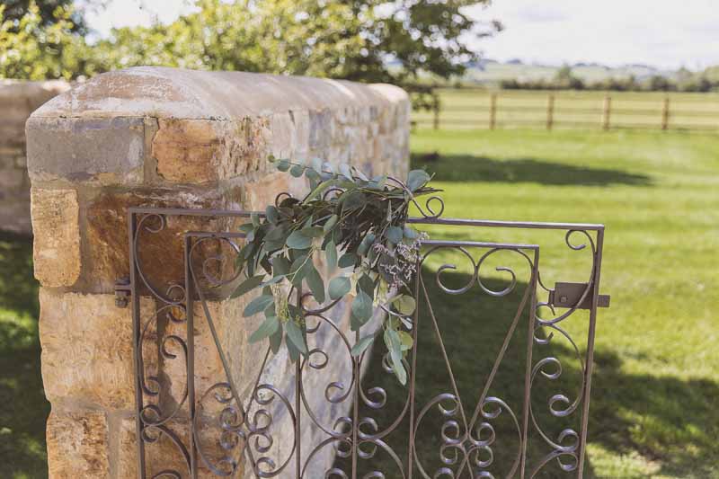 Barn wedding welcome gate flowers Passion for Flowers
