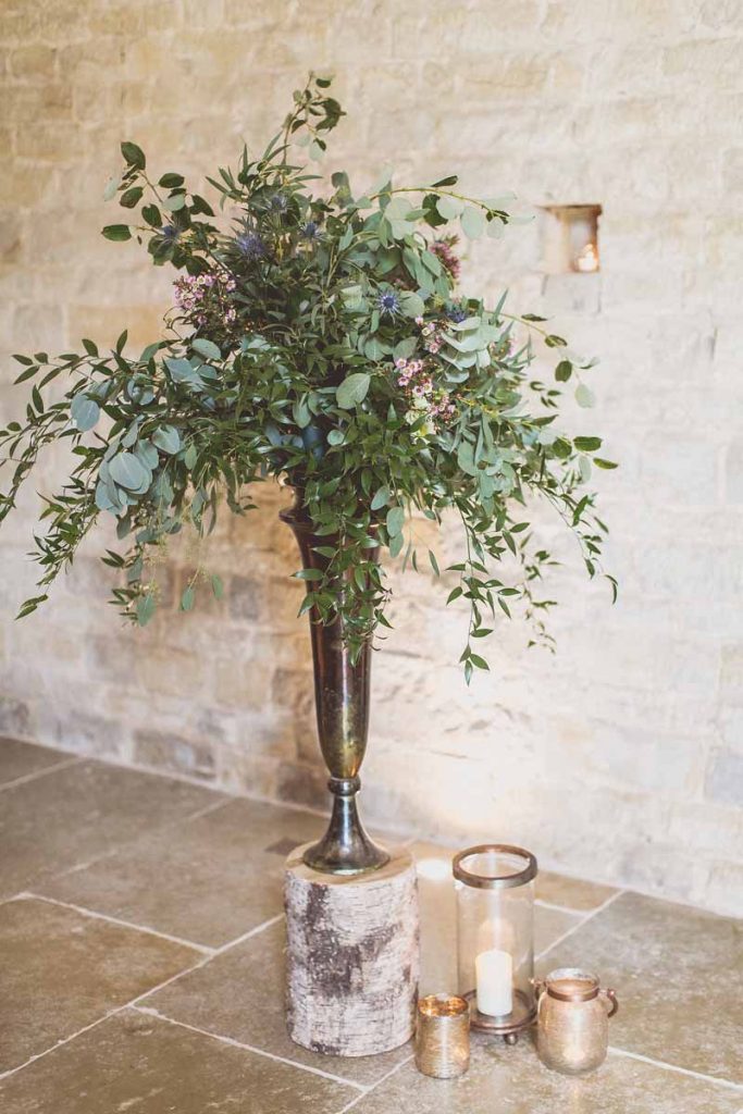 Foliage green and rustic tree stumps bronze vases barn wedding Blackwell Grange Passion for Flowers Florist