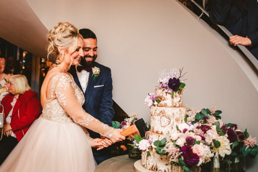 Wedding cake cutting with axe