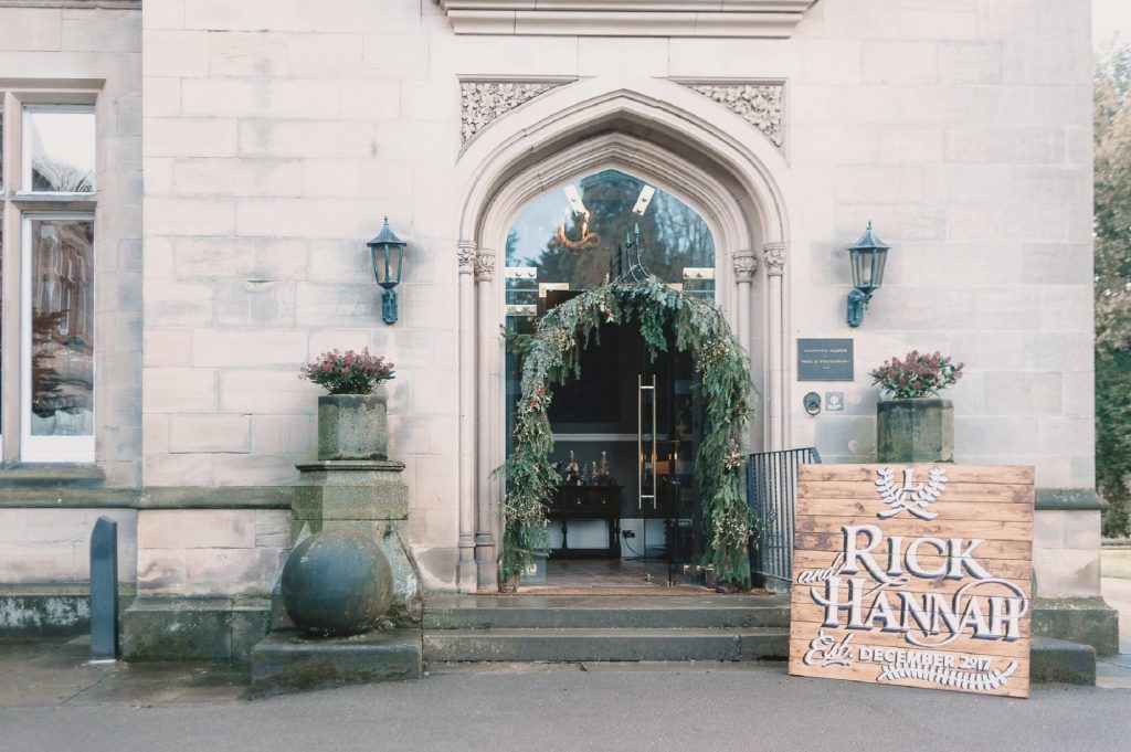Hampton Manor wedding entrance archway large wooden welcome signs