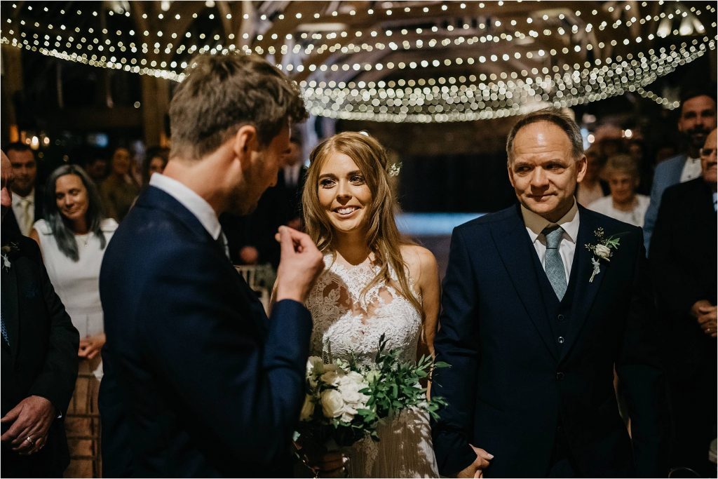 Gorgeous barn wedding with fair lights, lanterns and candles - designed by Passion for Flowers wedding florists