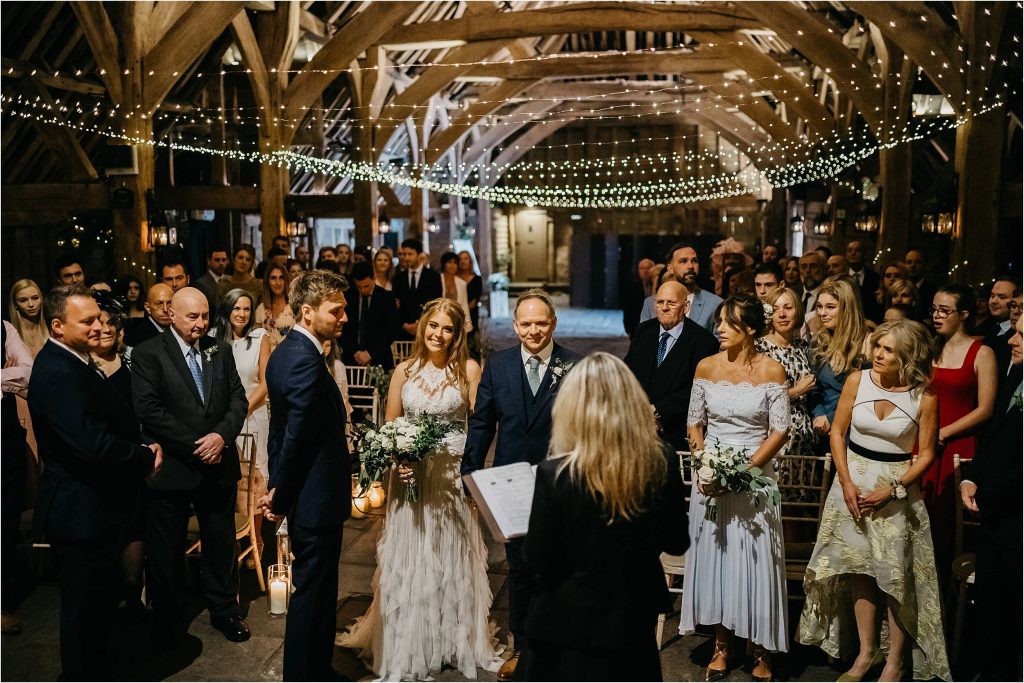 Gorgeous barn wedding with fair lights, lanterns and candles - designed by Passion for Flowers wedding florists
