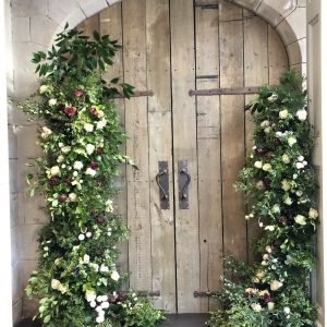 Organic style wedding arch asymmetric doorway florals by Passion for Flowers.jpg