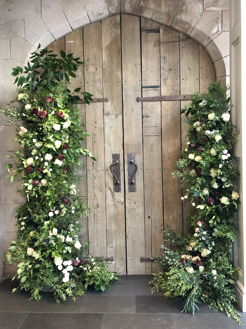 Organic style wedding arch asymmetric doorway florals by Passion for Flowers.jpg