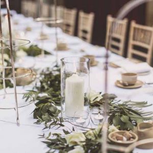 Long tables Hampton Manor simple foliage garlands with candles Passion for Flowers
