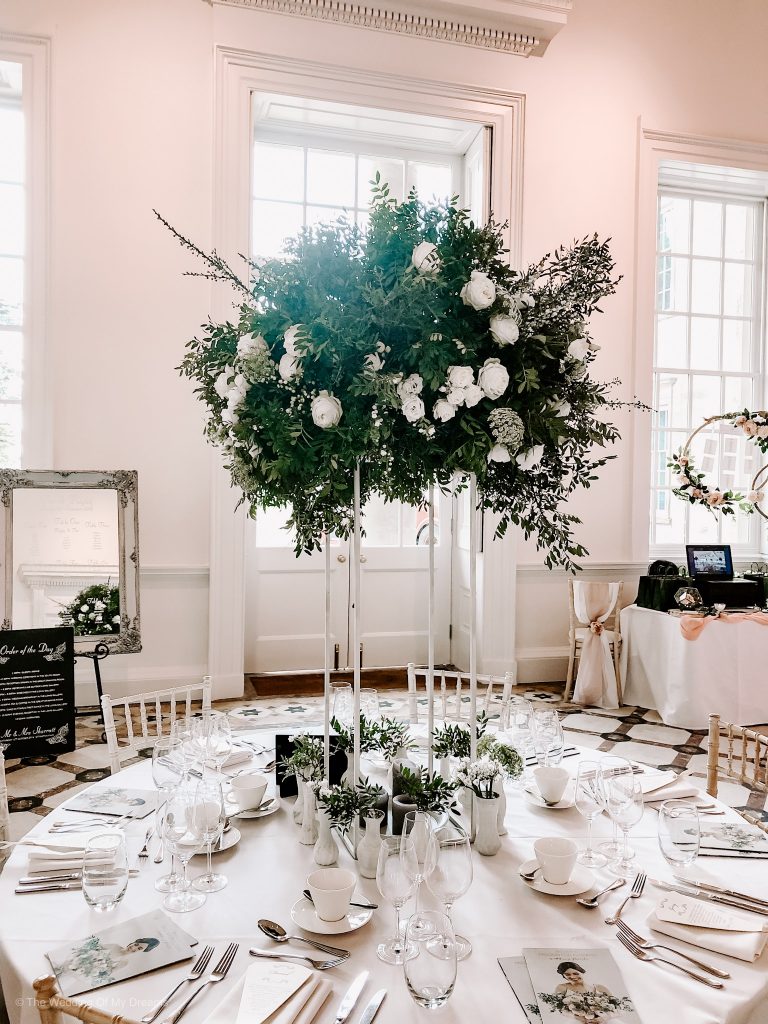 White green tall wedding centrepiece Compton Verney wedding white floral stand tall Passion for Flowers