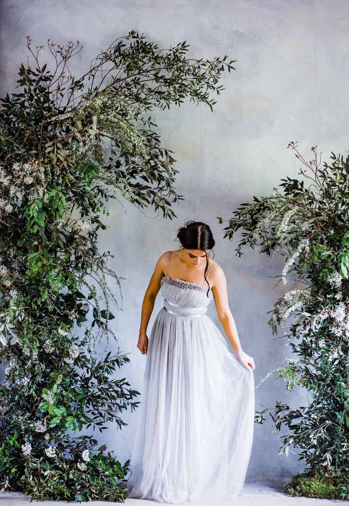 Foliage green white deconstructed arch wedding ceremony asymmetric design no foam Passion for Flowers