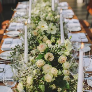 Green and white wedding garlands along tables at Hampton Manor by Passion for Flowers