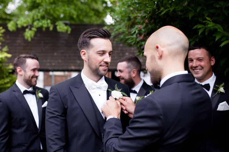 Black tie wedding button holes